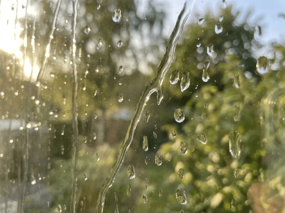 Water beading on a freshly cleaned window